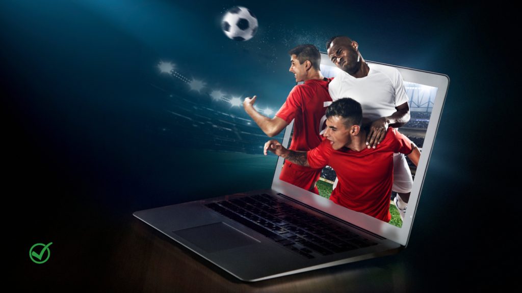 des joueurs de foot qui sortent de l'écran d'un ordinateur portable